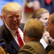 President Donald Trump shake hands after speaking at Snap-On Tools on April 18, 2017 in Wisconsin (AP Photo/Kiichiro Sato)